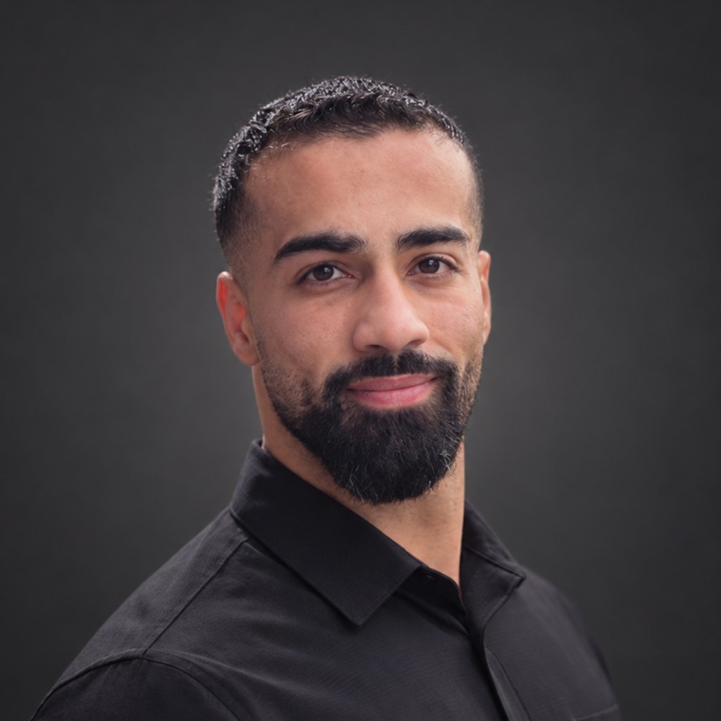 Portrait of Aladdin Hamed against a dark obsidian background.